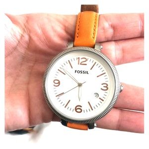 Over sized fossil watch with orange leather strap